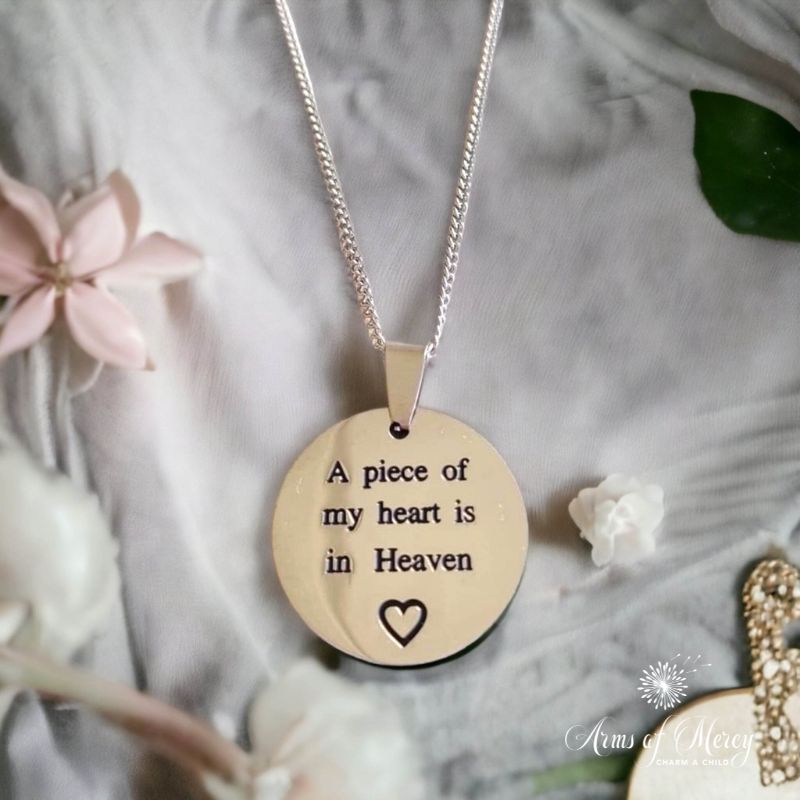 A Piece of My Heart is in Heaven Round Pendant in Stainless Steel on Chain - Arms of Mercy NPC